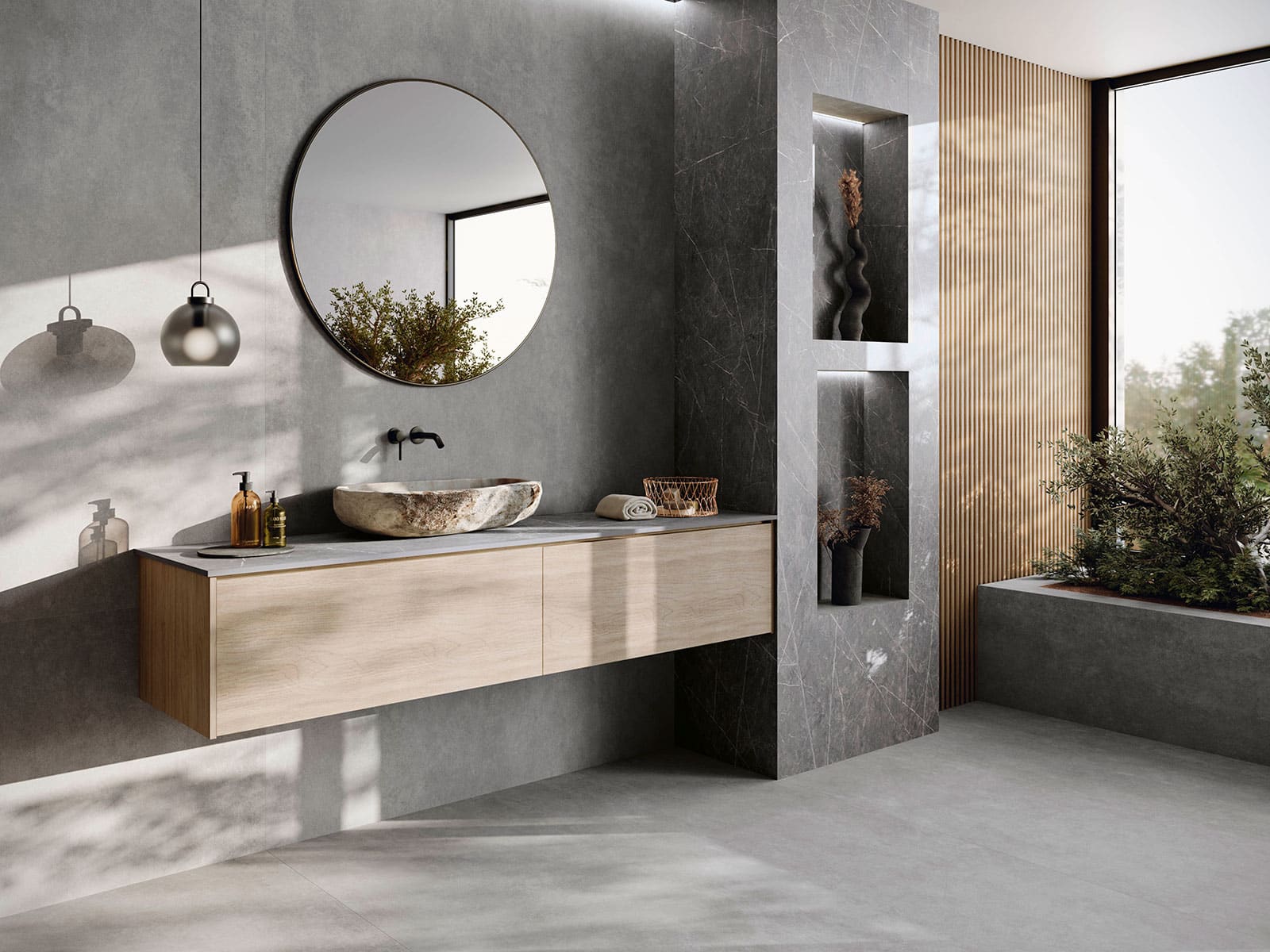 Modern bathroom vanity with round mirror and natural light