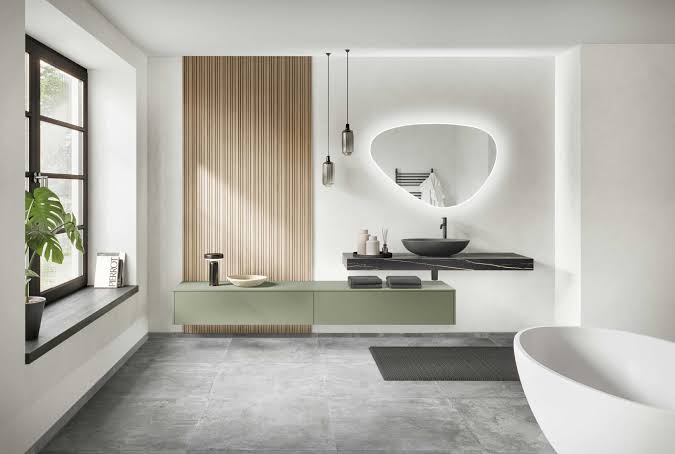 Bathroom vanity with wood accent wall and freestanding tub