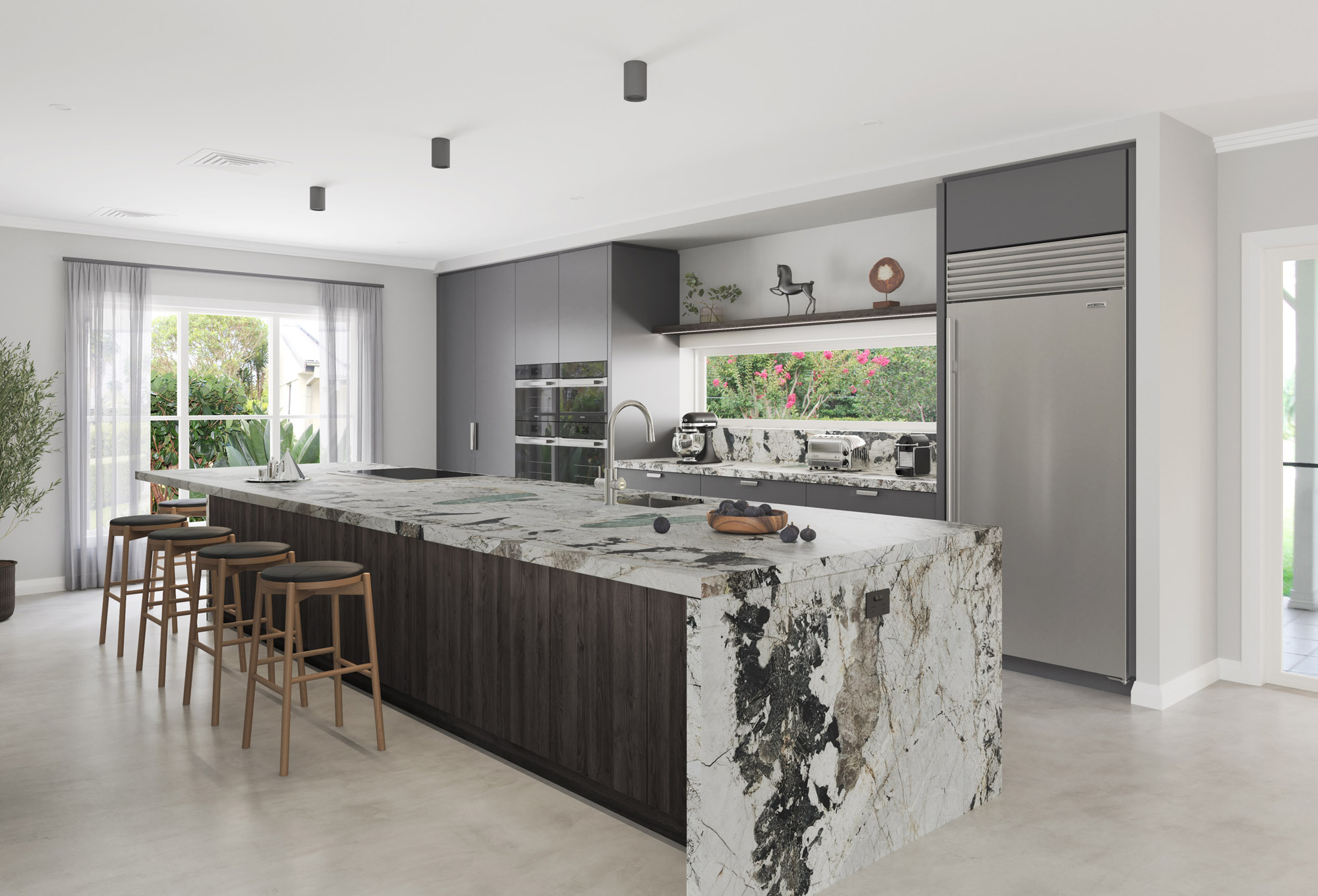 Kitchen with waterfall island and garden view windows